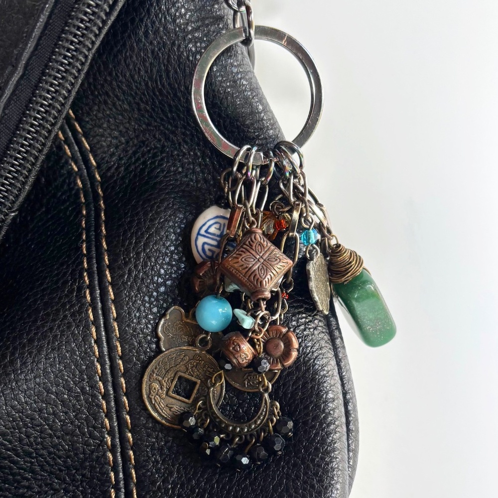 A PURSE CHARM with a "Bohemian Rhapsody" Theme